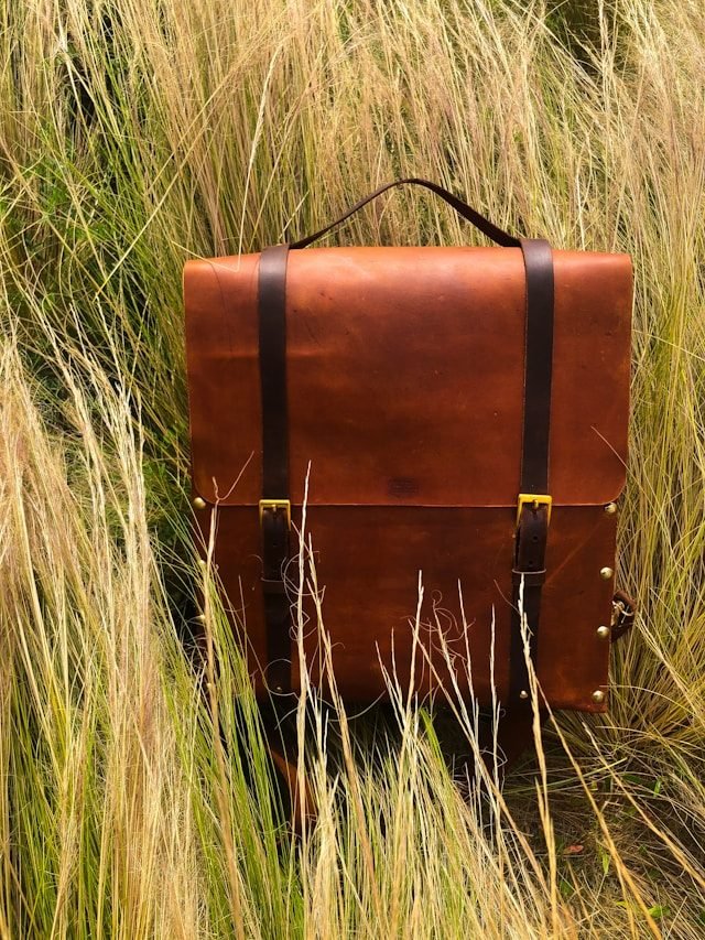 Artisan inspecting full-grain leather hide
